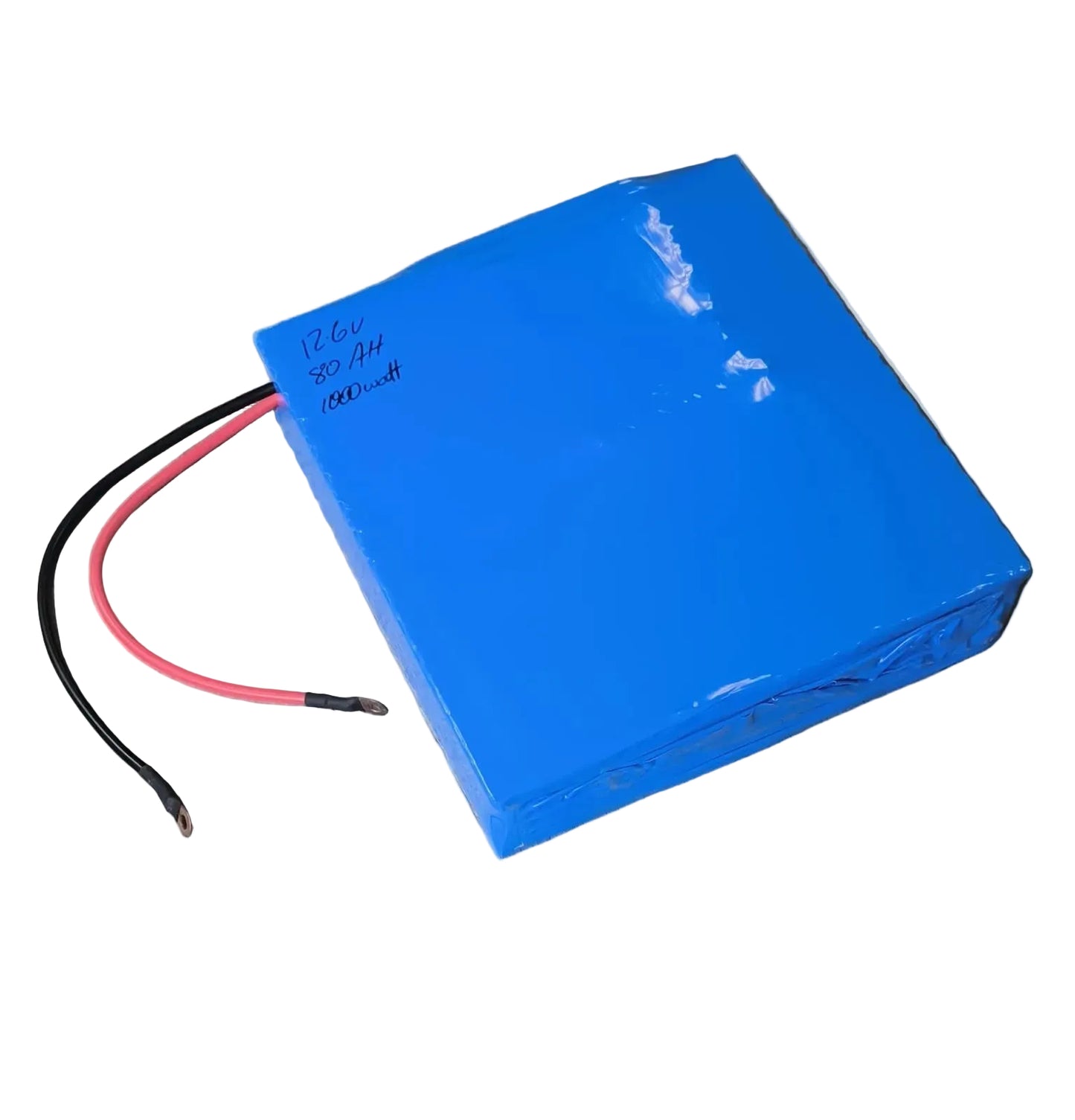 Blue battery pack with cables on a wooden floor