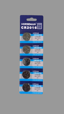 Pack of Horseman CR2016 lithium batteries on a wooden surface
