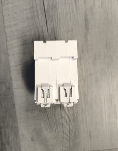 White electrical switch on a wooden surface